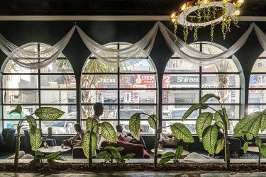 People socialise in the Arbe coffee shop, on one of the newest commercial streets in the Wadajir district.