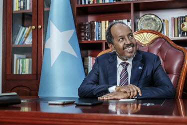 Hassan Sheikh Mohamud, President of Somalia, sits at a desk in his office in Villa Somalia, in the presidential compound, during an interview with the Financial Times.