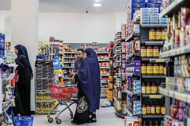 A couple shopping at the Hayat Market supermarket, on one of the newest commercial streets in the Wadajir district.