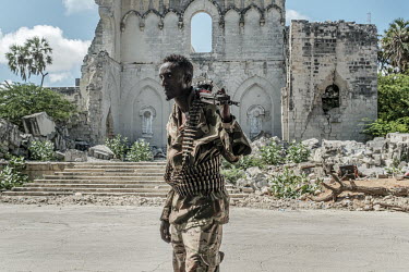 A soldier in front of the the ruins of the Italian-built Mogadishu cathedral.