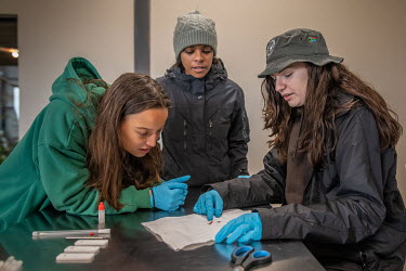 Students prepare to carry out a presumptive blood test in the laboratory of the Wildlife Forensic Academy.
