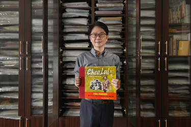 Record collector Dr Hsu Deng-fang with a rare record featuring Paul Robeson and a Chinese Chorus one of the discs from his huge collection.