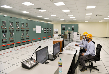 Taipower workers monitor power flows inside the control room of the Taipower Company's Chang Yi Switching Station which manages power transfer from both wind and solar generated electricity into the n...