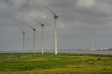 A row of massive wind turbines near the Taipower Company's Chang-Yi Switching Station, on Taiwan's windswept west coast.