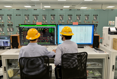 Taipower workers monitor power flows inside the control room of the Taipower Company's Chang Yi Switching Station which manages power transfer from both wind and solar generated electricity into the n...