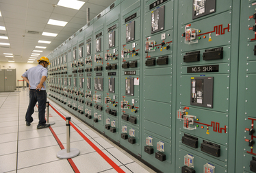 A Taipower worker monitors an instrument panel inside the control room of the Taipower Company's Chang-Yi Switching Station which manages power transfer from both wind and solar generated electricity...