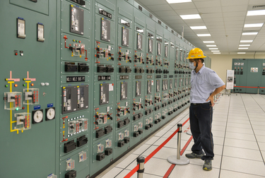 A Taipower worker monitors an instrument panel inside the control room of the Taipower Company's Chang-Yi Switching Station which manages power transfer from both wind and solar generated electricity...