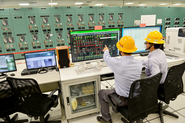 Taipower workers monitor power flows inside the control room of the Taipower Company's Chang Yi Switching Station which manages power transfer from both wind and solar generated electricity into the n...