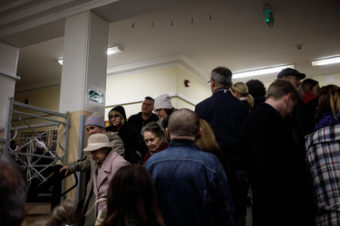 People queing at a polling station in a primary school before voting in the 15 October 2023 parliamentary elections.