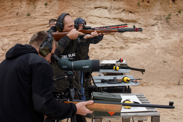 People take part in a shooting competition at a range near the Belarus border.