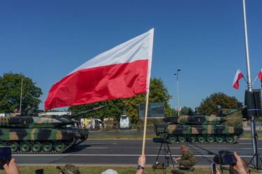 German-made Leopard 2 tanks roll past a large crowd who have came to watch the largest military parade ever held in post-communist Poland. The event involved 2,000 soldiers and 200 pieces of military...
