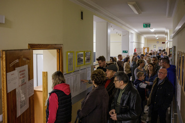 People queing at a polling station in a primary school before voting in the 15 October 2023 parliamentary elections.