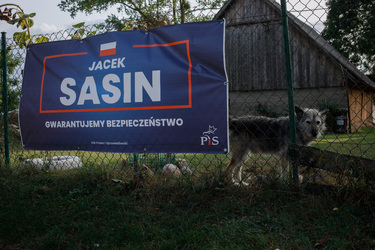 An election banner for Jacek Sasin (PiS - the ruling Law & Justice party) with a slogan that claims: 'We guarantee security', in Usnarz Gorny on the Belarus border.