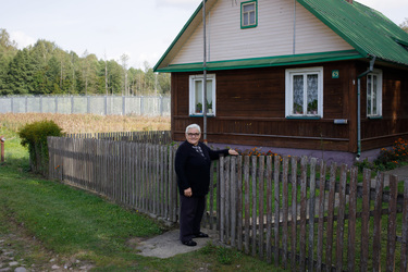 Ms Renia who lives in a house just by the border wall with Belarus.