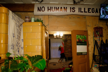 A sign reads: 'No human is illegal', in the home, near the Belarus border, of family of activists who help illegal migrants crossing the frontier.