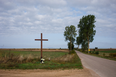 A Catholic cross standing at a crossroads near Krynki near Belarus border.