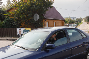 An election banner for Szymon Holownia who is from the Third Way Party, the current opposition, hanging at a crossroads in Krynki near the Belarus border.