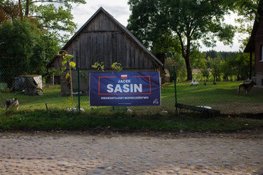 An election banner for Jacek Sasin (PiS - the ruling Law & Justice party) with a slogan that claims: 'We guarantee security', in Usnarz Gorny on the Belarus border.