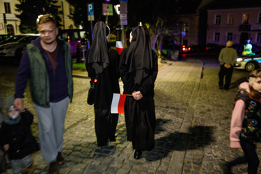 Two nuns holding Polish flags after attending a PiS (Law and Justice) party rally in the town prior to the 15 October 2023 parliamentary elections.